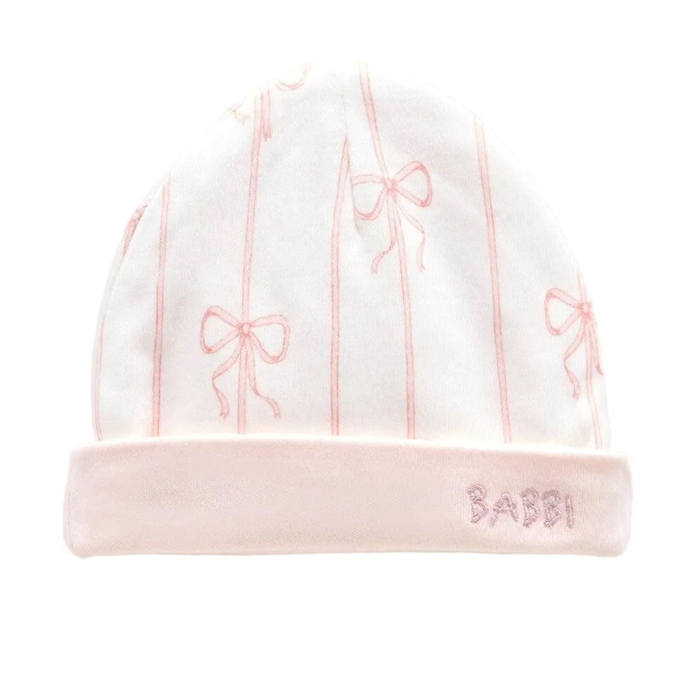 babymutsje met strikjes print van atelier Babbi