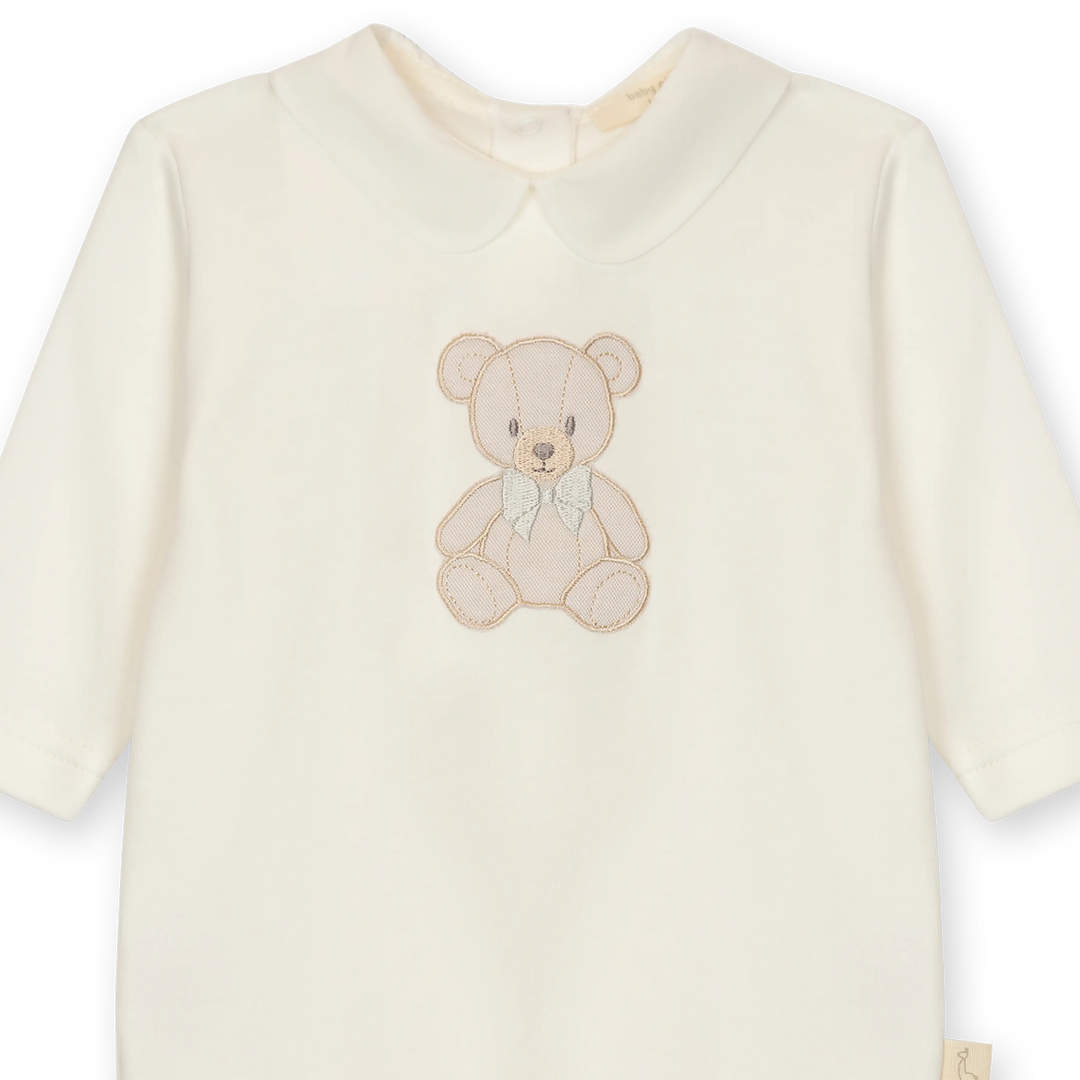 Katoenen babypakje met ronde kraag en teddybeer detail in crème kleur