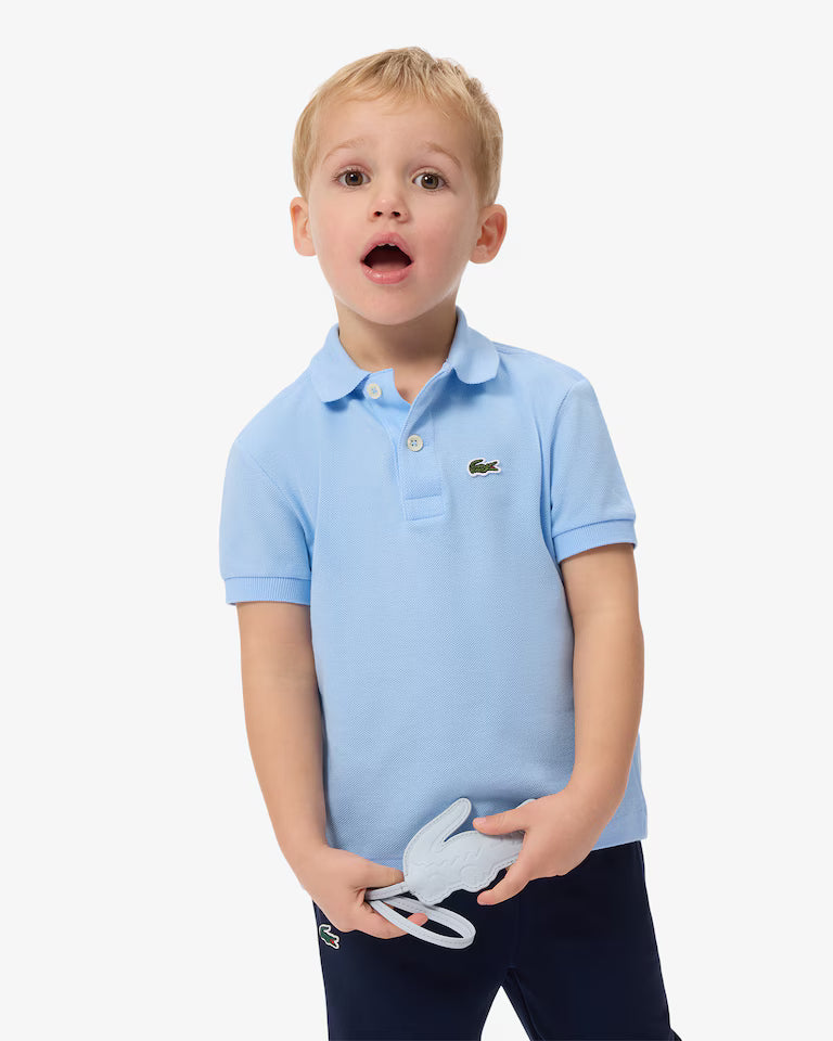 Lacoste polo bij jongentje in lichtblauw aan