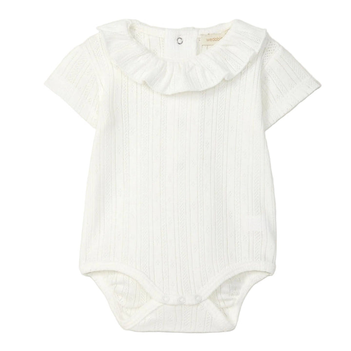 Offwhite romper met ajour motief in organic katoen van Wedoble 