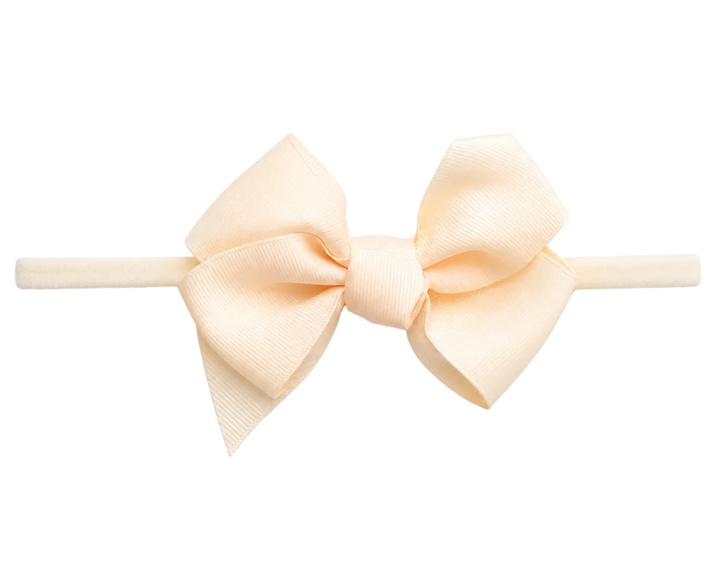 beige haarband met grote haarstrik van siena 
