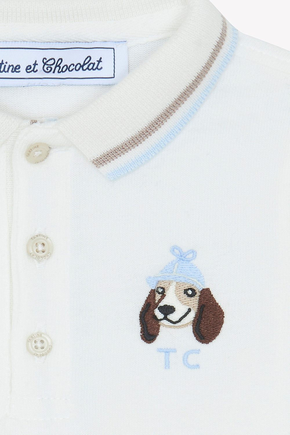 witte offwhite polo met geborduurd hondje en TC logo 