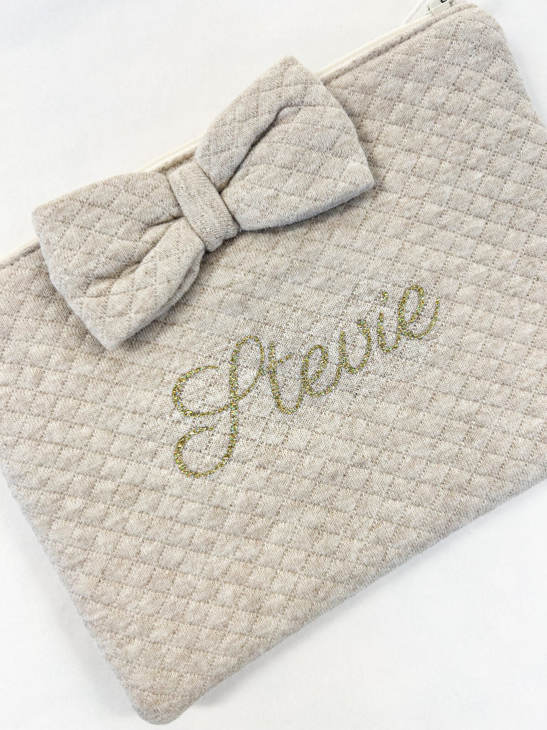 Beige toilettasje met strik in losange stof 