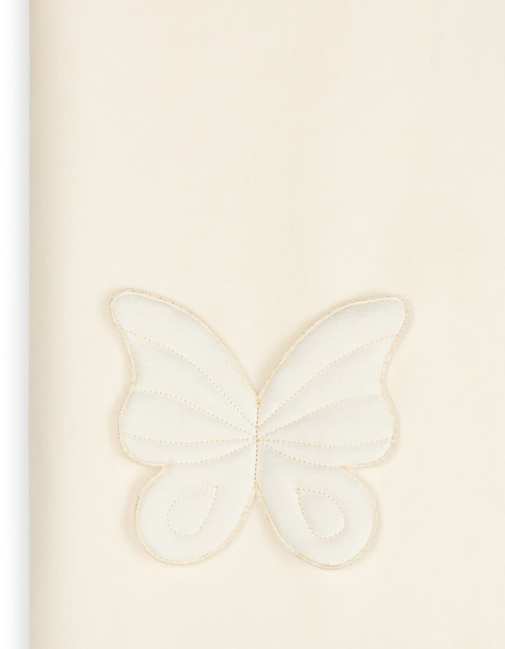 Detail van het 3D vlinderdetail met losvallende vleugels op de Baby Gi velours babydeken in offwhite